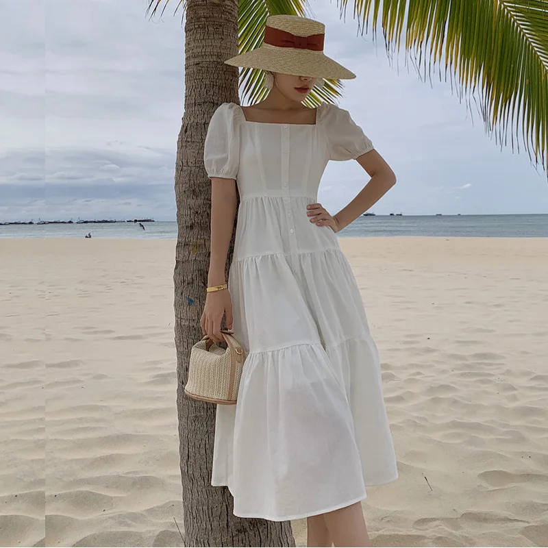 Vestido longo branco em eventos corporativos: O equilíbrio entre formalidade e moda