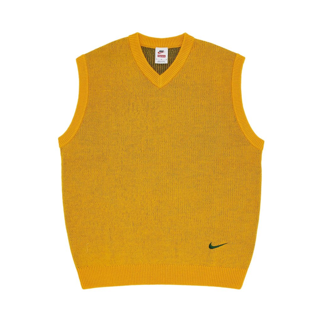 yellow sweater vest