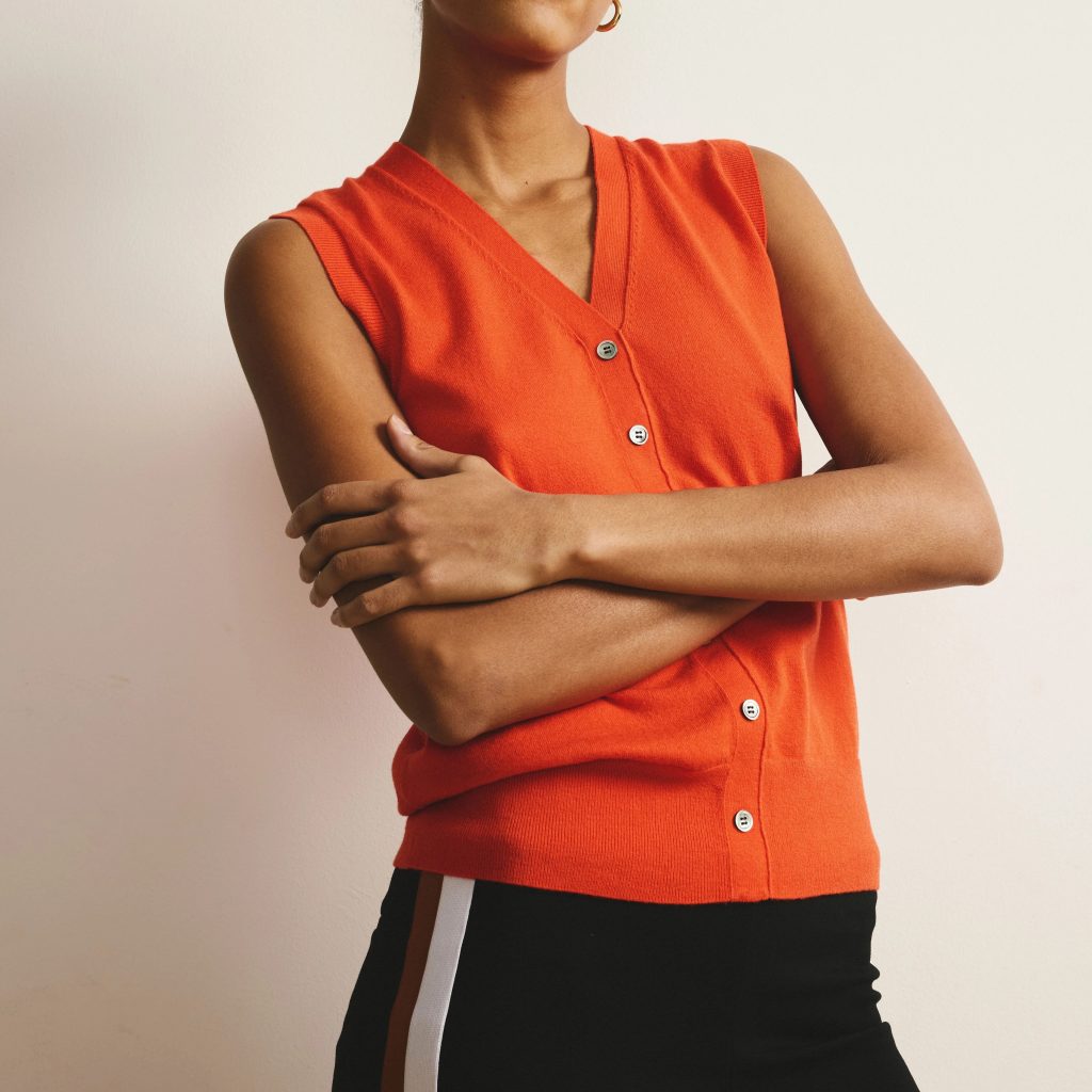 orange sweater vest